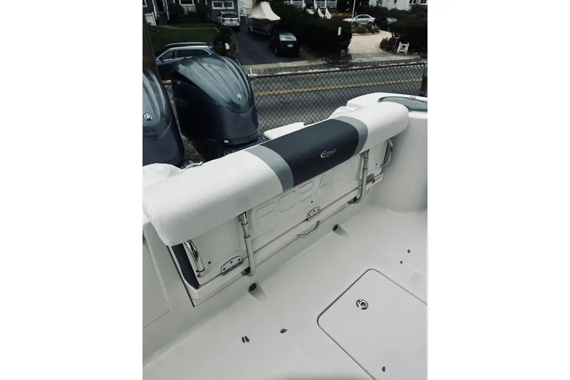 Slide: The Image of 2022 Robalo R272 Center Console boat with dual outboard engines. - 38