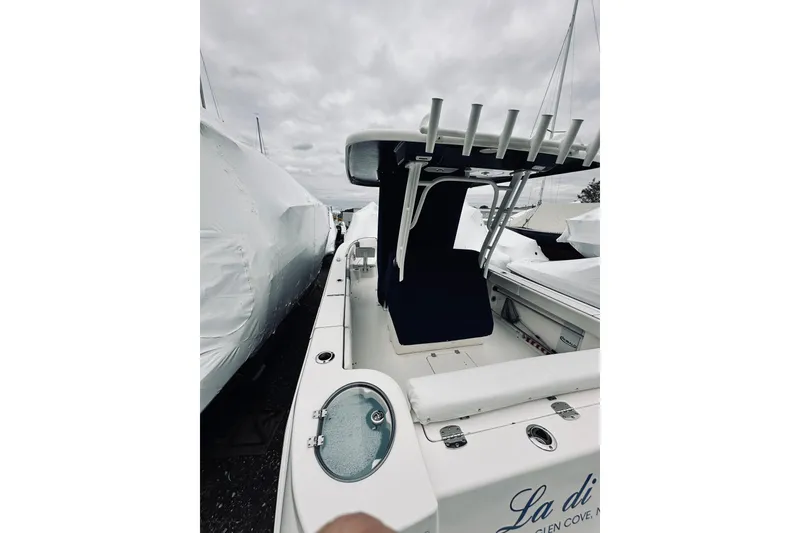 Slide: The Image of 2022 Robalo R272 Center Console boat with sleek design and spacious deck. - 40