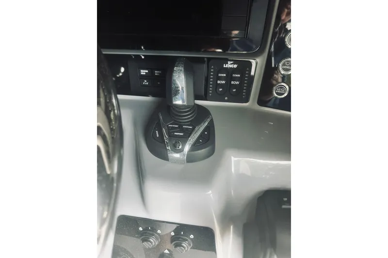 Slide: The Image of 2022 Robalo R272 Center Console boat controls and joystick. - 48