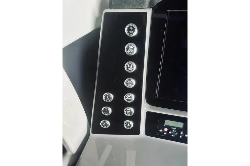 Slide: The Image of Control panel of 2022 Robalo R272 Center Console boat with labeled buttons. - 50