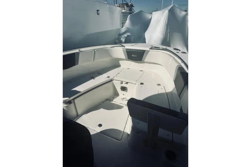 Slide: The Image of 2022 Robalo R272 Center Console boat interior, featuring spacious seating and storage. - 53