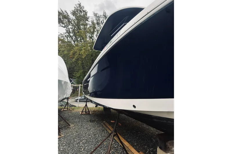 Slide: The Image of 2022 Robalo R272 Center Console boat on stands, side view. - 6
