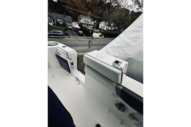 Slide: The Image of 2022 Robalo R272 Center Console boat interior with seating and speaker detail. - 60