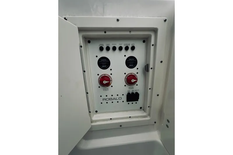Slide: The Image of Control panel of 2022 Robalo R272 Center Console boat with switches and dials. - 62