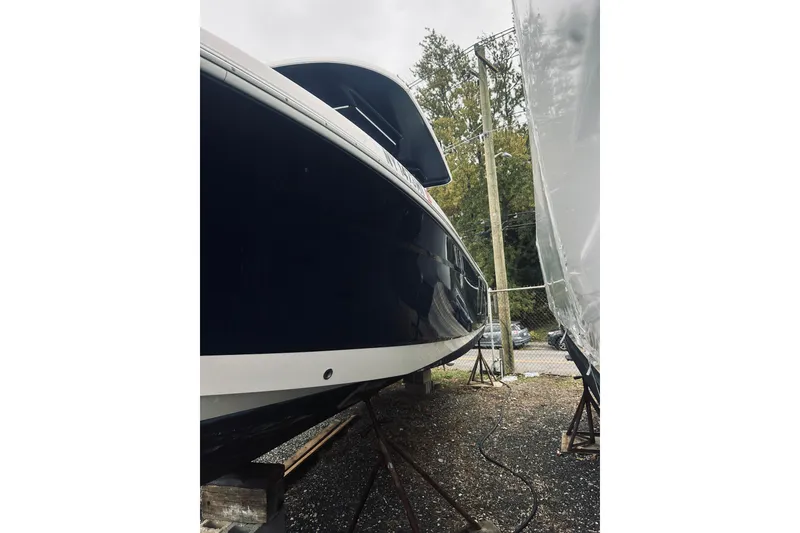 Slide: The Image of 2022 Robalo R272 Center Console boat on stands, side view. - 7