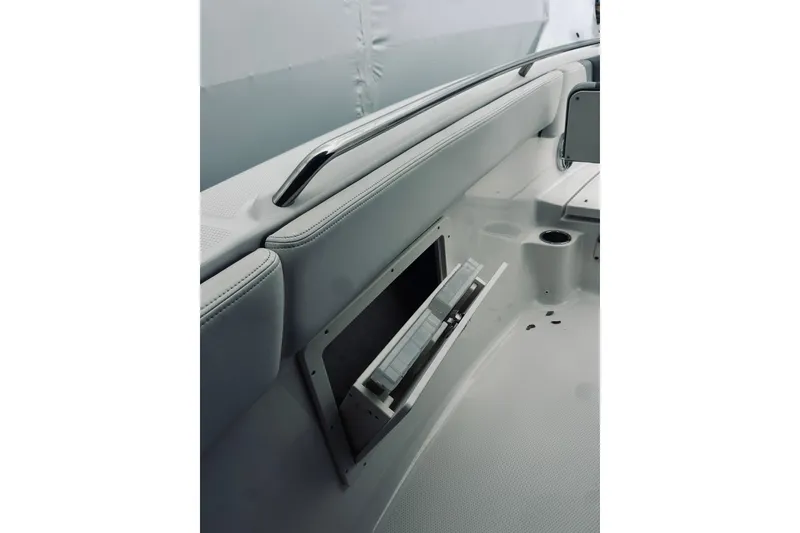 Slide: The Image of 2022 Robalo R272 Center Console interior with storage compartment and seating. - 73