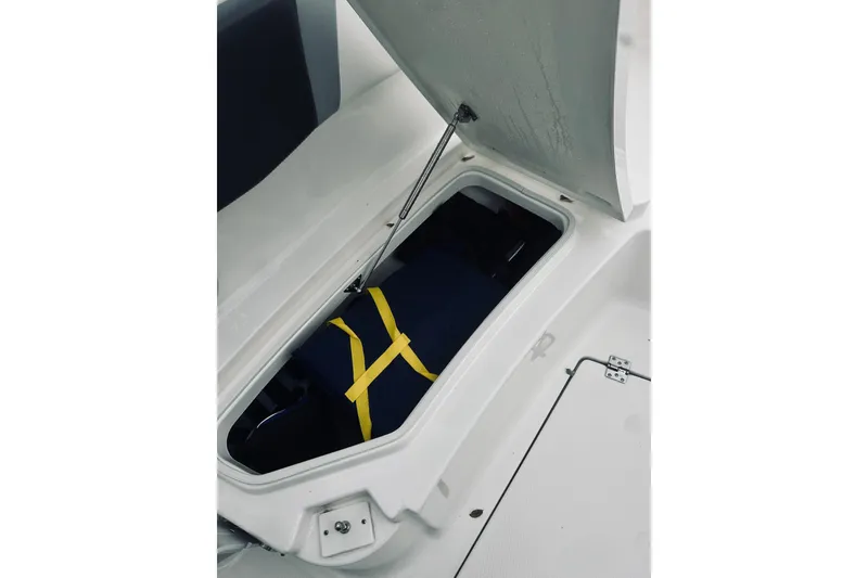 Slide: The Image of Storage compartment in 2022 Robalo R272 Center Console boat, featuring secure interior space. - 77