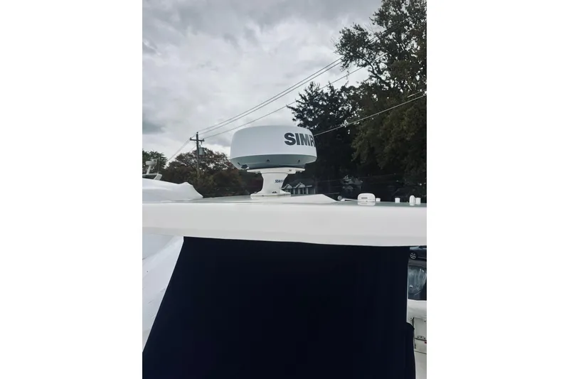 Slide: The Image of 2022 Robalo R272 Center Console with Simrad radar on top. - 86