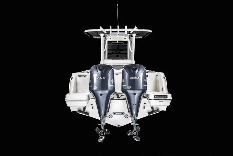 Slide: The Image of Manufacturer Provided Image: 2022 Robalo R272 Center Console boat with twin 250 horsepower engines, rear view. - 89