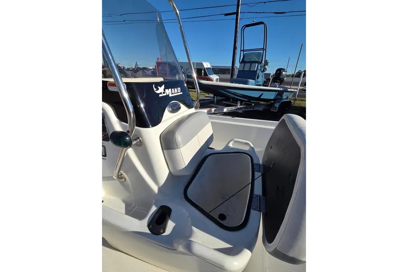 Slide: The Image of 2018 Mako Pro Skiff 17 CC boat interior with open storage compartment. - 5
