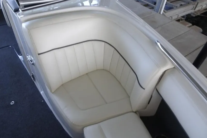 Slide: The Image of 2008 Cobalt 232 boat interior with white leather seating and sleek design. - 16