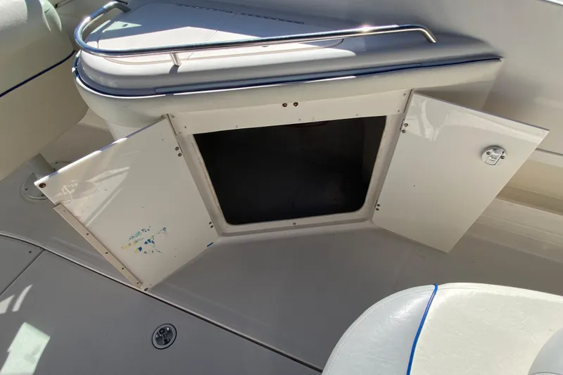 Slide: The Image of Open storage compartment on a 2002 Monterey 268SS Super Sport boat. - 16