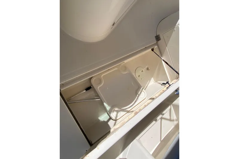 Slide: The Image of Open storage compartment in a 2002 Monterey 268SS Super Sport boat. - 17