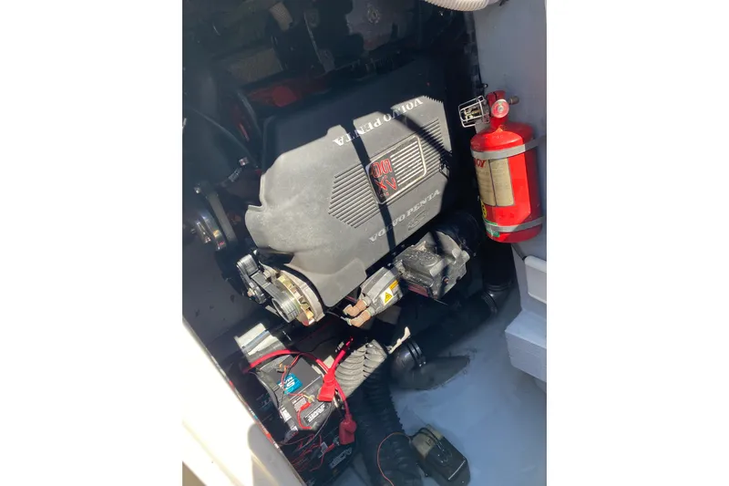 Slide: The Image of Engine compartment of 2002 Monterey 268SS Super Sport with Volvo Penta engine and fire extinguisher. - 22