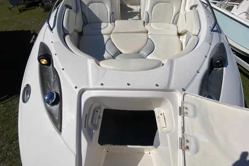 Slide: The Image of 2002 Monterey 268SS Super Sport boat interior with seating and storage compartment. - 24