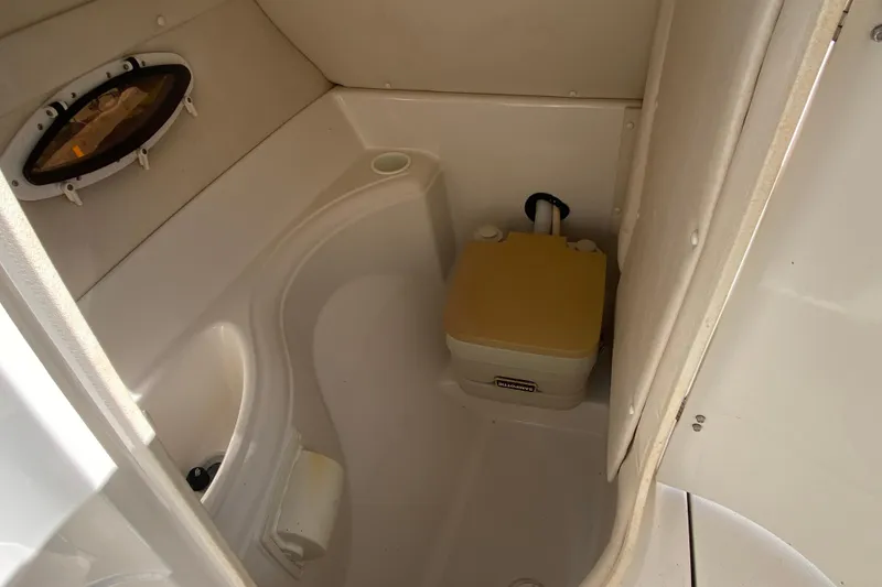 Slide: The Image of Compact bathroom in 2002 Monterey 268SS Super Sport boat with portable toilet. - 7