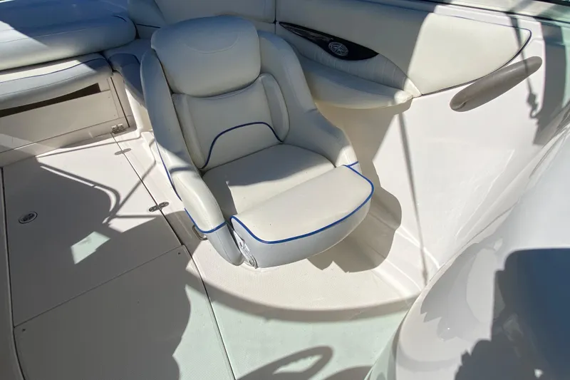 Slide: The Image of 2002 Monterey 268SS Super Sport boat interior with white seating and blue trim. - 8