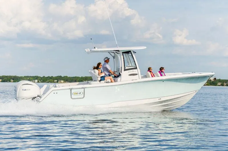 Slide: The Image of Manufacturer Provided Image: 2026 Sea Hunt Gamefish 27 boat cruising on a sunny day with passengers. - 2