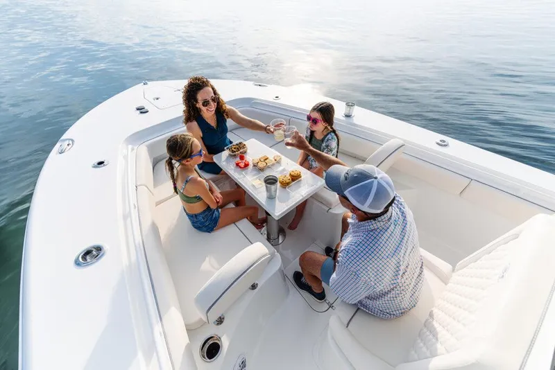 Slide: The Image of Manufacturer Provided Image: Family enjoying a meal on a 2026 Sea Hunt Gamefish 27 boat. - 6