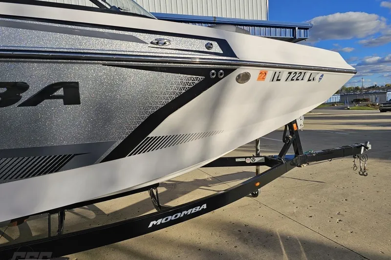 Slide: The Image of 2020 Moomba Max boat on trailer, featuring sleek design and modern graphics. - 12