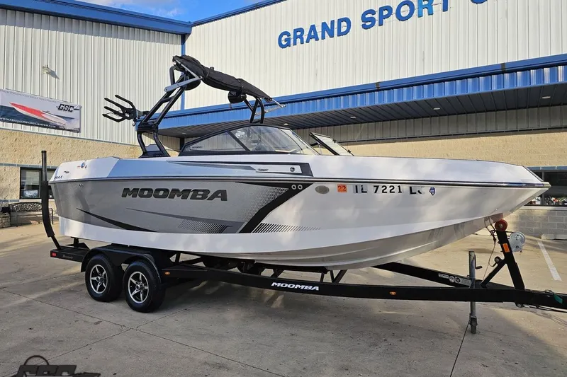 Slide: The Image of 2020 Moomba Max boat on trailer outside Grand Sport Center. - 13