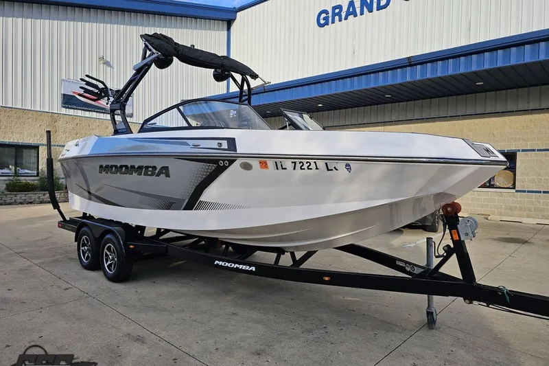 Slide: The Image of 2020 Moomba Max boat on trailer outside dealership building. - 14
