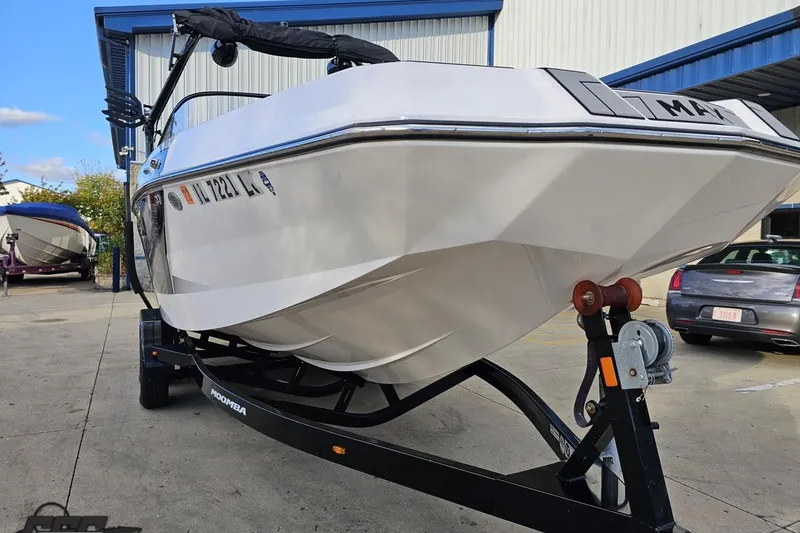 Slide: The Image of 2020 Moomba Max boat on trailer in a parking lot, front view. - 15