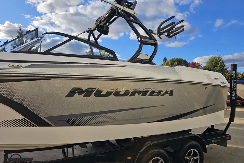 Slide: The Image of 2020 Moomba Max boat on trailer under blue sky with clouds. - 23