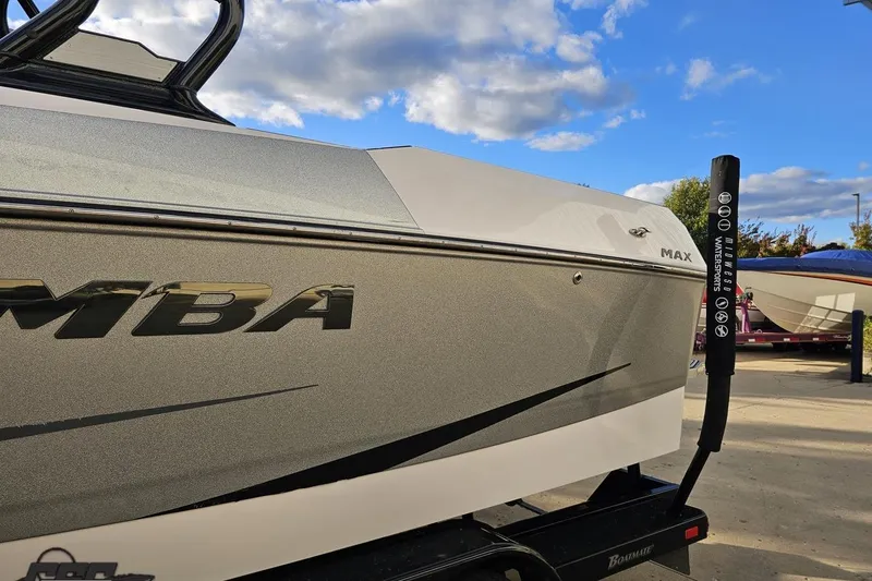 Slide: The Image of 2020 Moomba Max boat on trailer under blue sky with clouds. - 26