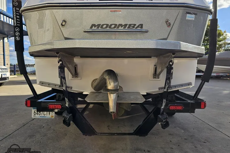 Slide: The Image of 2020 Moomba Max boat rear view on trailer, showcasing propeller and hull design. - 35