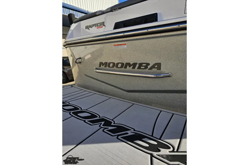 Slide: The Image of 2020 Moomba Max boat with Raptor engine, side view showing branding. - 36