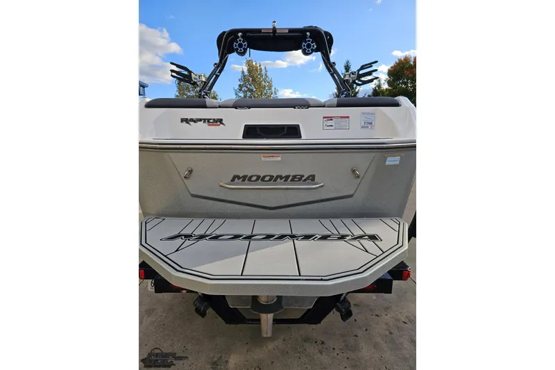 Slide: The Image of 2020 Moomba Max boat rear view with Raptor engine, blue sky background. - 38