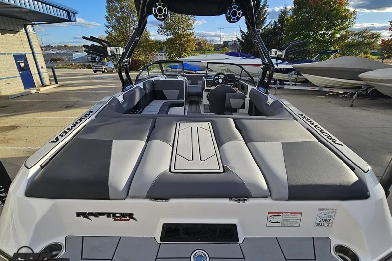 Slide: The Image of 2020 Moomba Max boat with spacious seating and sleek design, parked outdoors. - 39