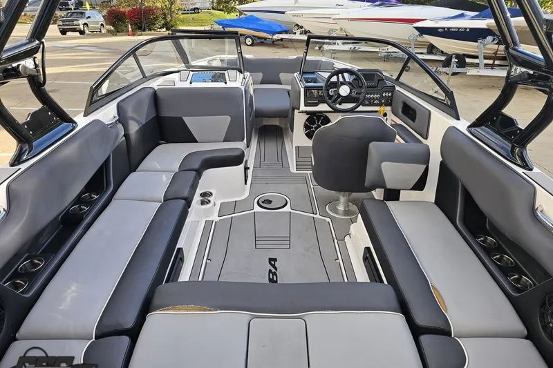 Slide: The Image of 2020 Moomba Max boat interior with gray seating and modern dashboard. - 46
