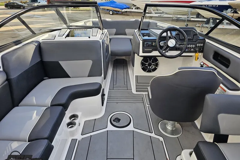 Slide: The Image of 2020 Moomba Max boat interior with modern seating and steering console. - 51