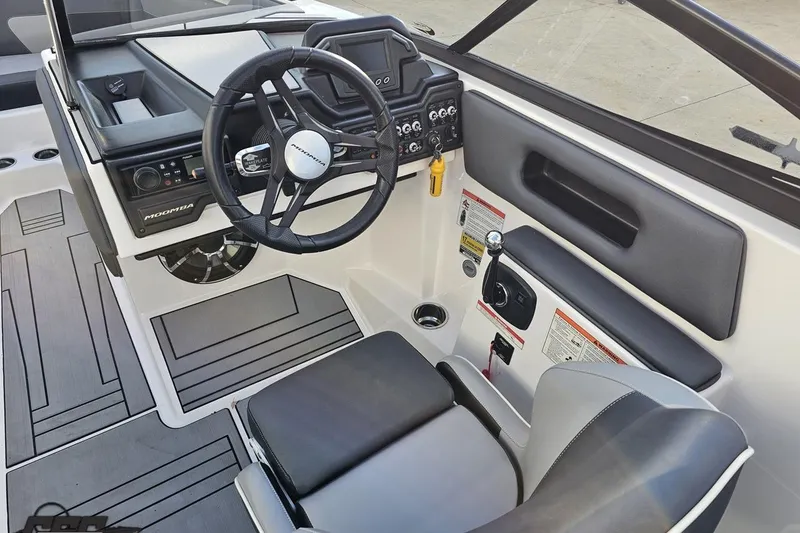 Slide: The Image of 2020 Moomba Max boat interior with steering wheel and control panel. - 55