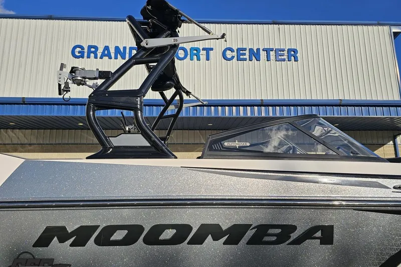 Slide: The Image of 2020 Moomba Max boat at Grand Sport Center, featuring Autowake technology. - 6