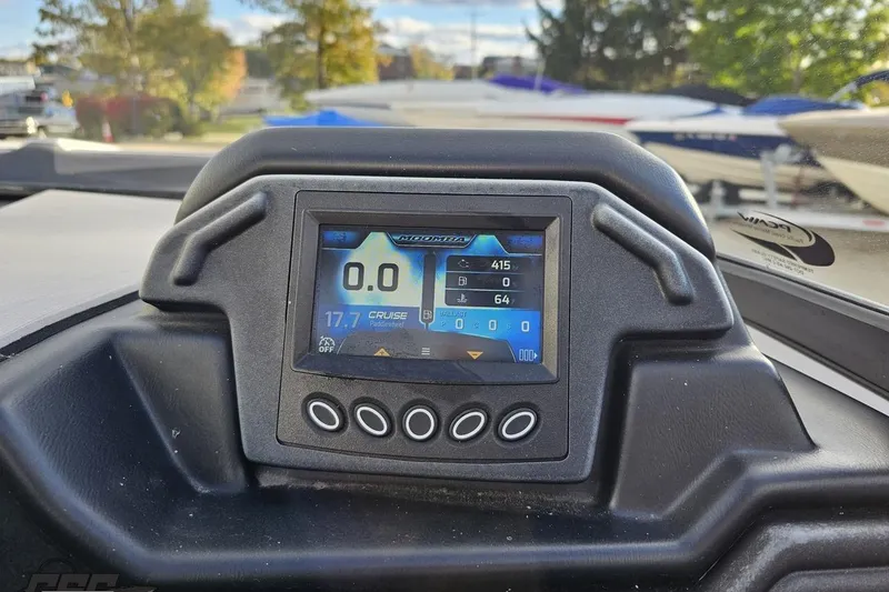 Slide: The Image of Dashboard of a 2020 Moomba Max boat with digital display and control buttons. - 60