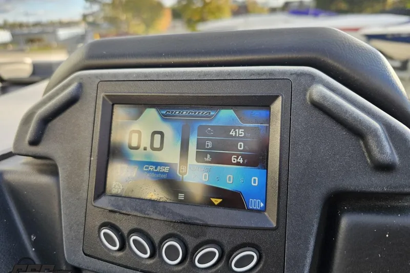 Slide: The Image of Dashboard of 2020 Moomba Max boat showing digital display and controls. - 61