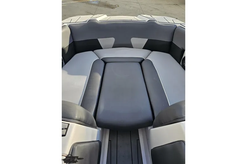 Slide: The Image of 2020 Moomba Max boat interior with gray and black seating. - 81