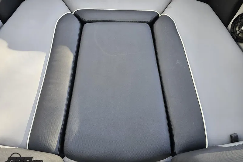 Slide: The Image of 2020 Moomba Max boat interior seating, featuring sleek gray and black upholstery. - 83