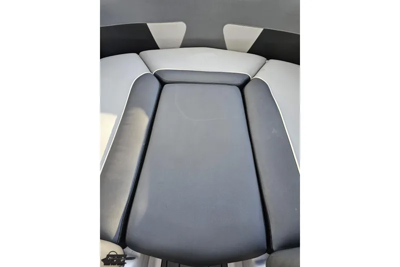 Slide: The Image of 2020 Moomba Max boat interior seating, featuring sleek black and gray upholstery design. - 84