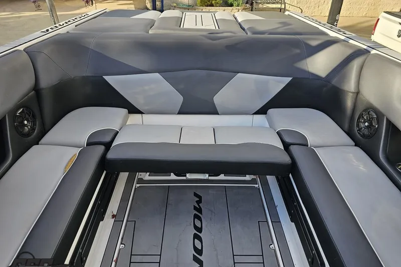 Slide: The Image of 2020 Moomba Max boat interior with gray seating and speakers. - 85