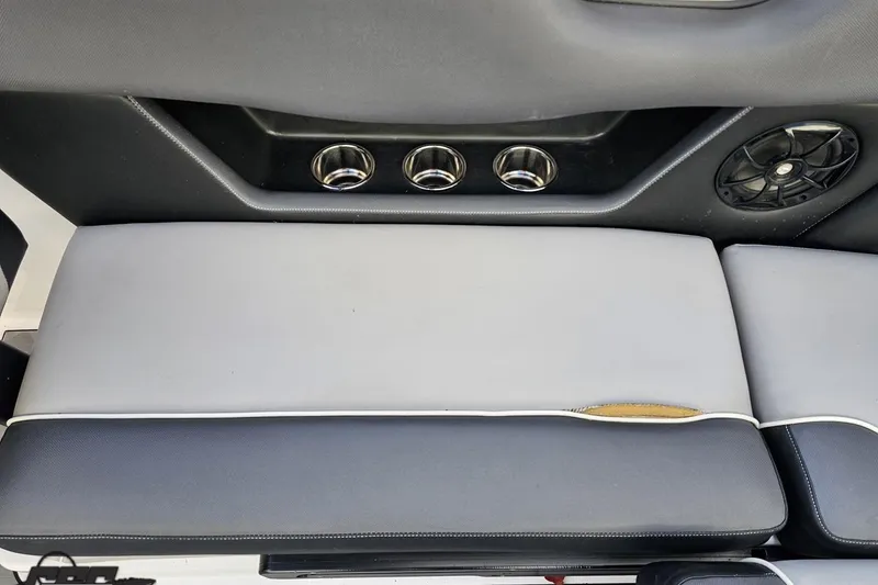 Slide: The Image of 2020 Moomba Max boat interior with cup holders and speaker. - 87