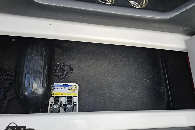 Slide: The Image of Storage compartment in 2020 Moomba Max boat with transom tie-downs and rope. - 88