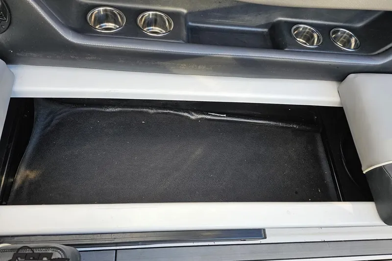 Slide: The Image of 2020 Moomba Max boat interior storage compartment with cup holders. - 89