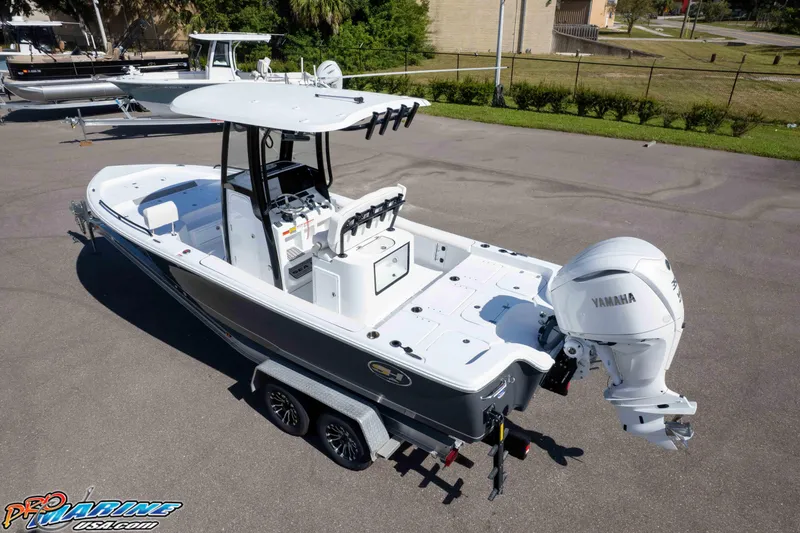 Slide: The Image of 2026 Sea Hunt BX 25 FS boat with Yamaha engine on trailer, parked outdoors. - 10