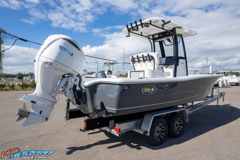 Slide: The Image of 2026 Sea Hunt BX 25 FS boat on trailer with Yamaha outboard motor, parked outdoors. - 16