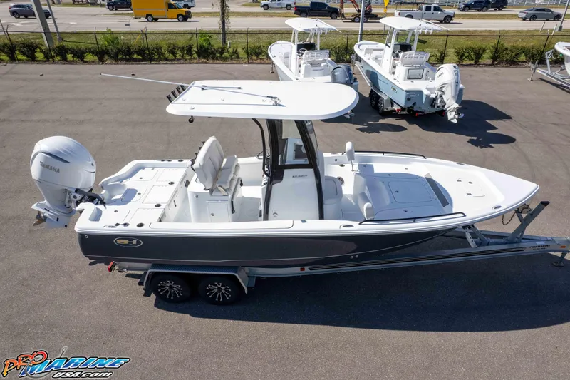 Slide: The Image of 2026 Sea Hunt BX 25 FS boat on trailer, featuring Yamaha outboard motor. - 22