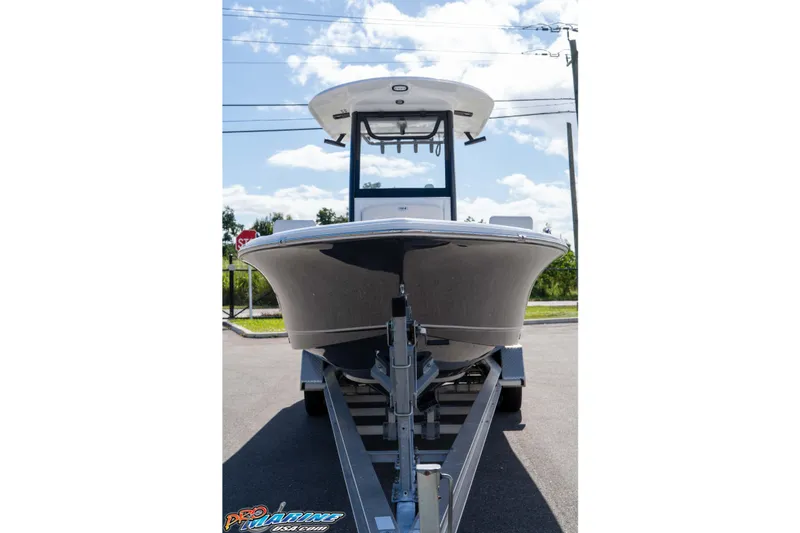 Slide: The Image of 2026 Sea Hunt BX 25 FS boat on trailer, front view, outdoors. - 23